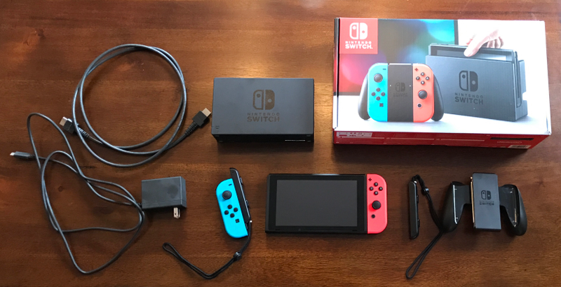 In the box: The Switch, two Joy-Con (multicolored or grey), a dock, two Joy-Con caps, a Joy-Con grip, an AC adapter, and an HDMI cable.